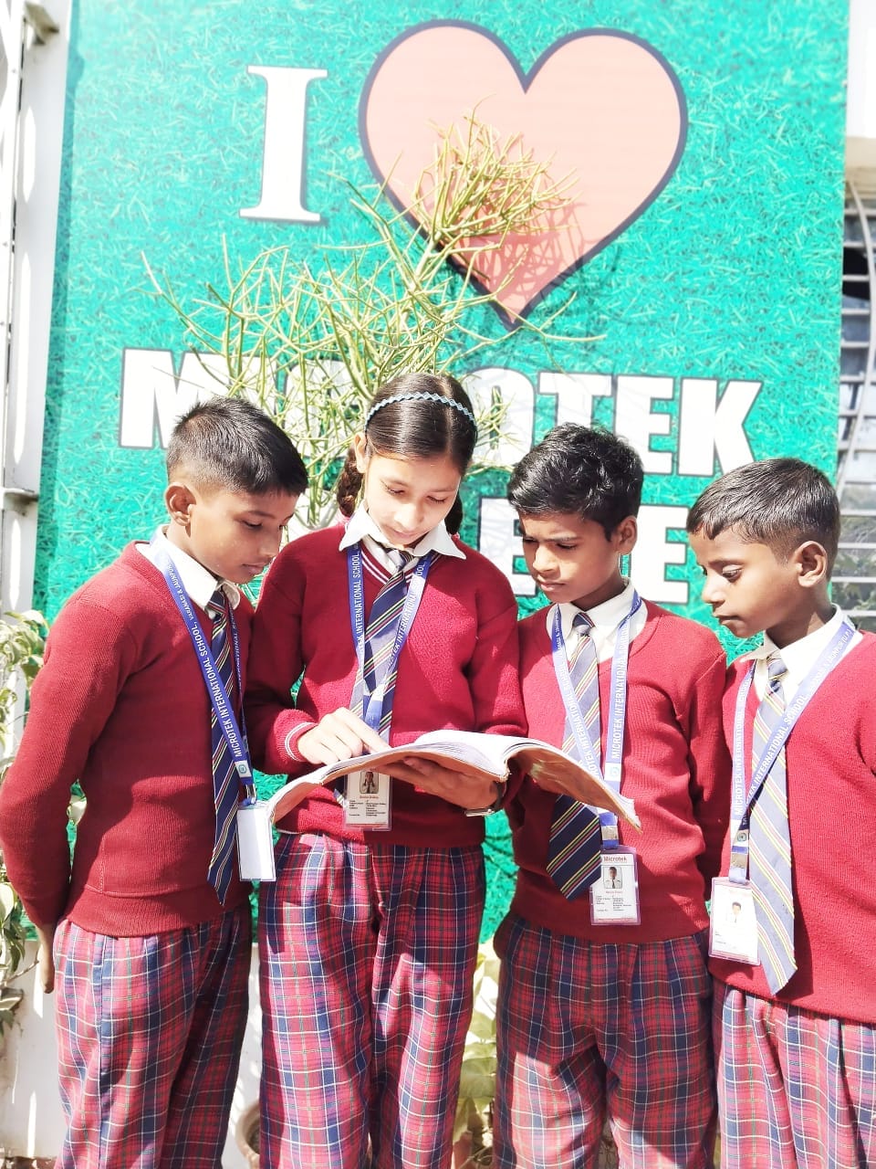 Students reading together at Microtek